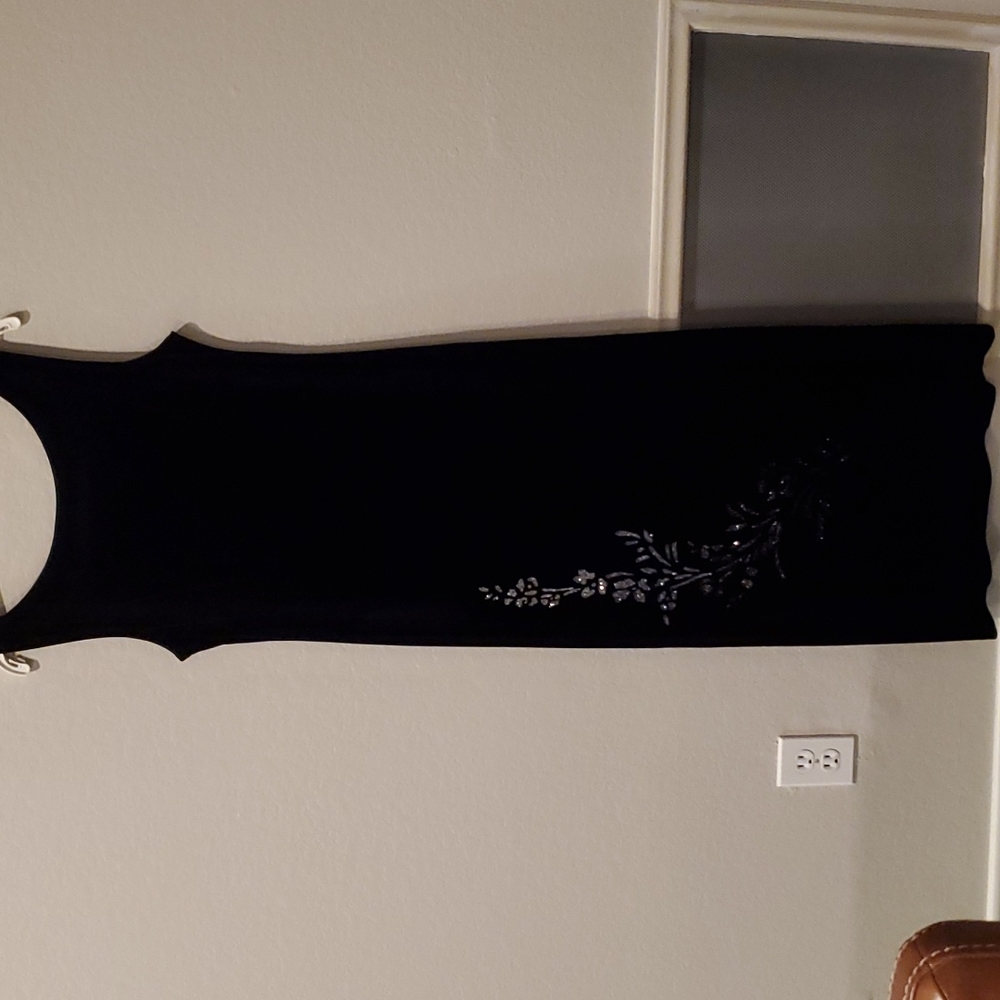 Black sleeveless evening dress with crystal applique